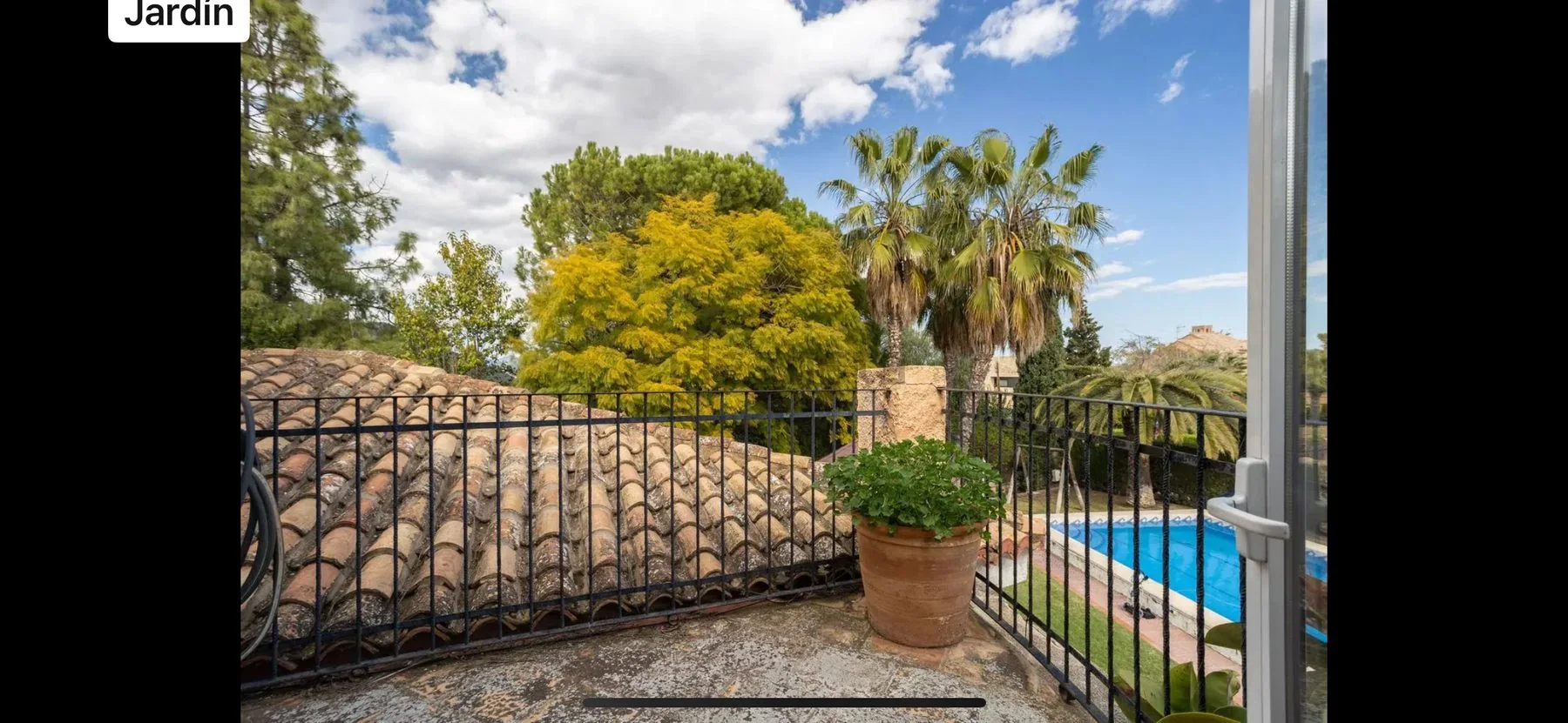 Terrace before renovation overlooking the garden and pool