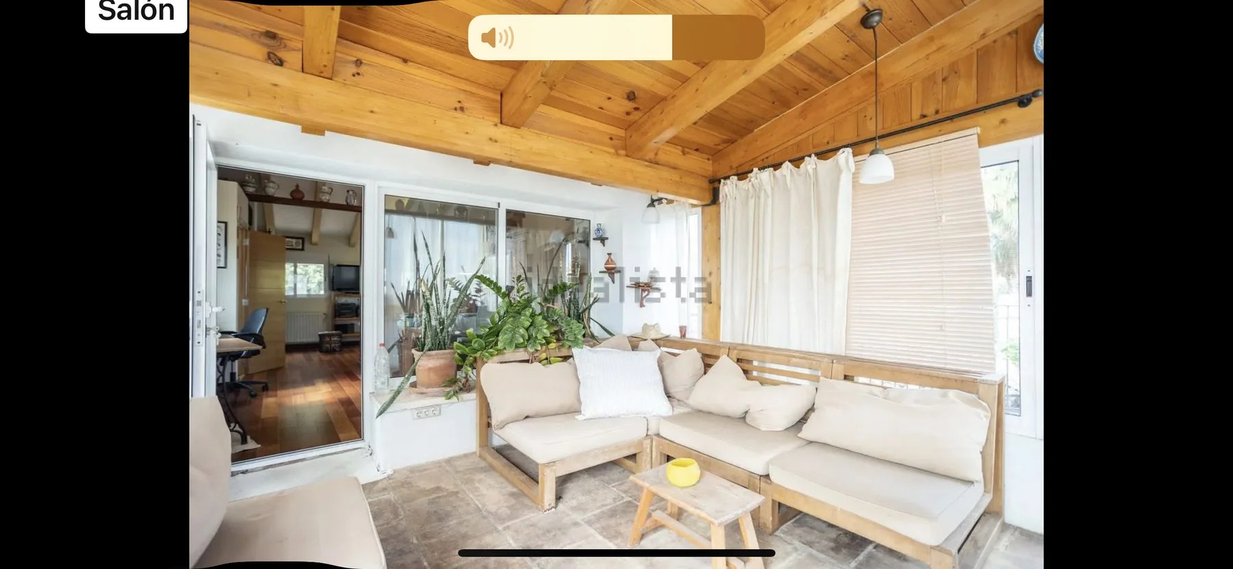 Earlier sunroom with timber ceiling and bright windows